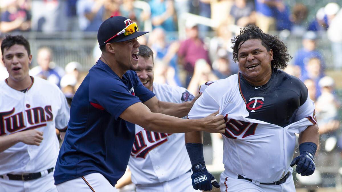 Minnesota’s Willians Astudillo, right, is mobbed by teammates after hitting a ninth-inning walkoff.