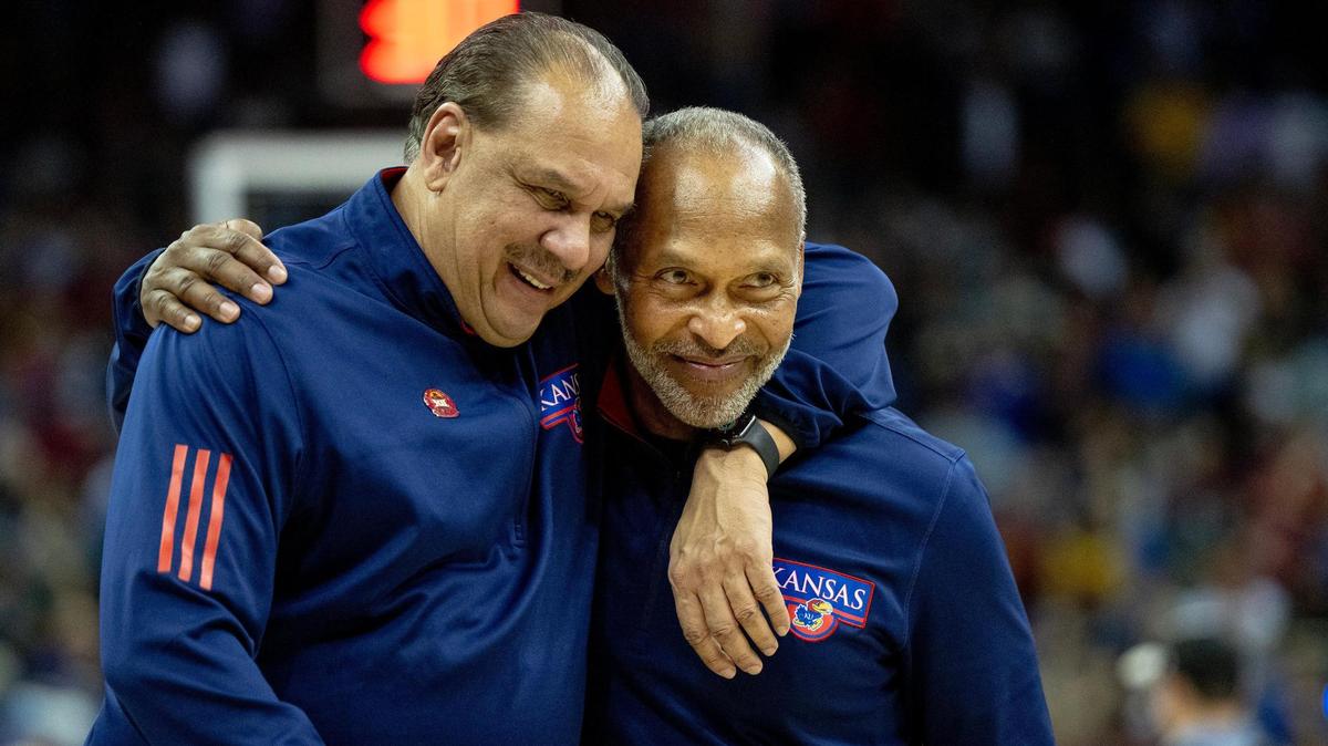 Acting Kansas coach Norm Roberts celebrates with assistant coach Kurtis Townsend after defeating Iowa State in the semifinal round of the Big 12 Conference tournament Friday, March 10, 2023, in Kansas City.