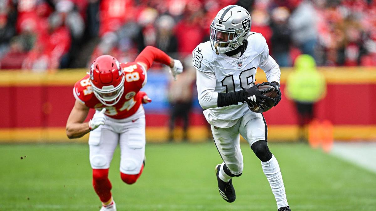 Las Vegas Raiders cornerback Jack Jones (18) picked off a pass intended for Kansas City Chiefs wide receiver Justin Watson (84) and ran it in for a touchdown in the second quarter Monday, Dec. 25, 2023, at GEHA Field at Arrowhead Stadium.
