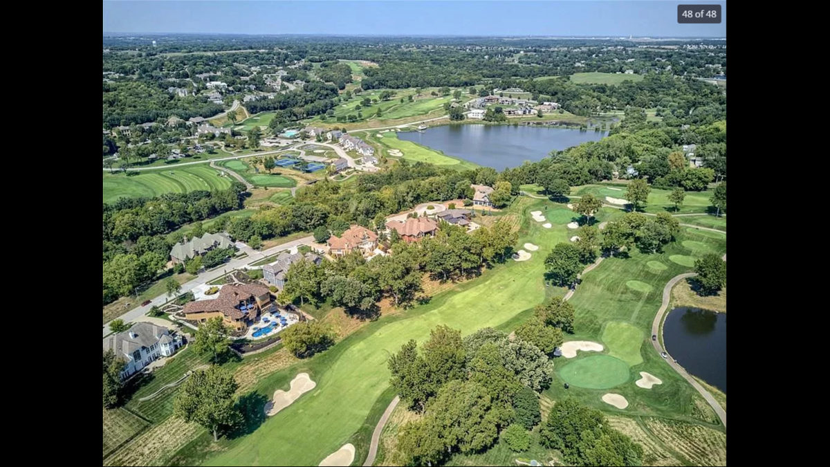A backyard view of the house at 6521 Ridge Road in Parkville. The fifth hole of The National Golf Club Golf Course is right behind the home.