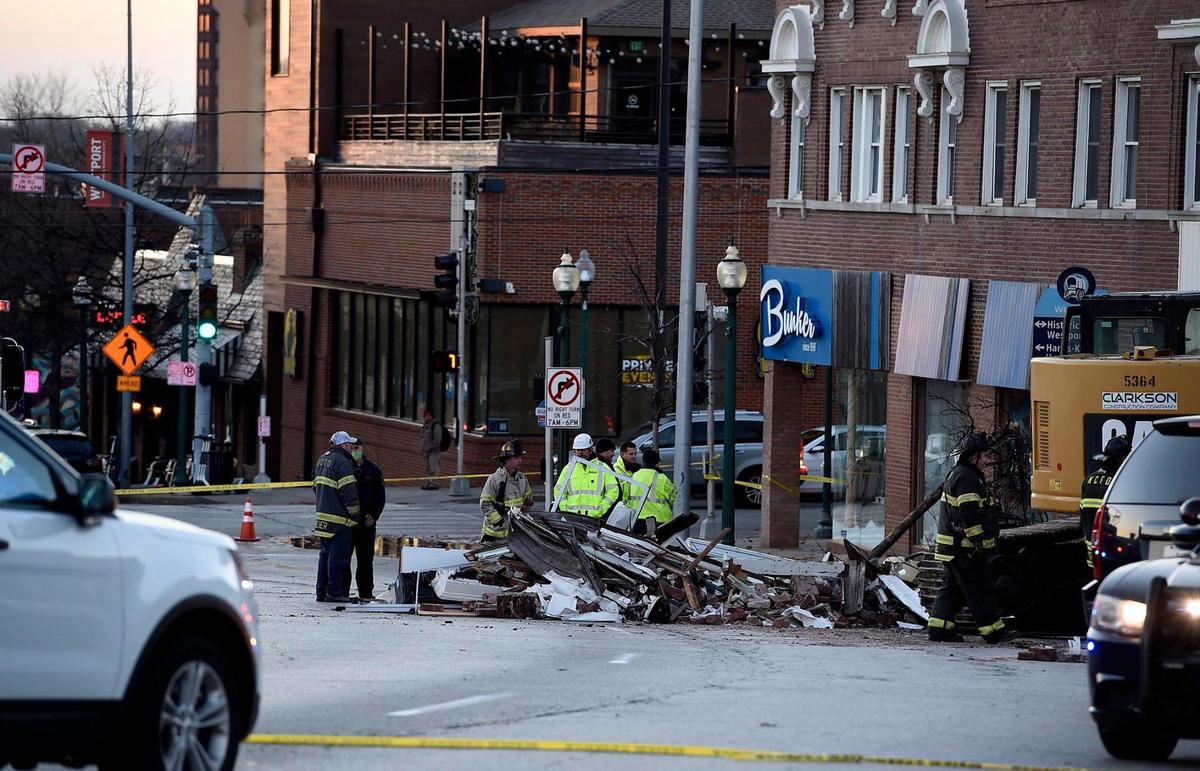 Two people were killed Wednesday night when a fire truck collided with an SUV and struck a building on Broadway Boulevard just north of Westport Road. Emergency crews were on the scene Thursday morning searching for a third victim who may have been in or near the building.