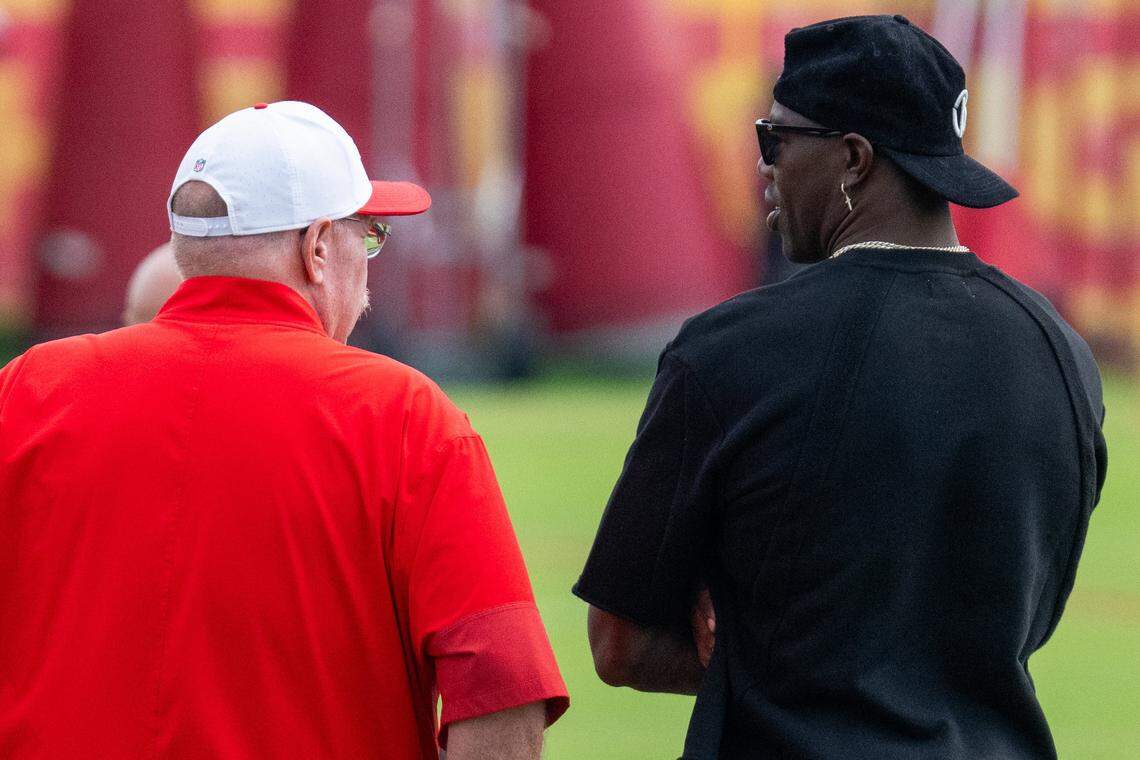 Former NFL wide receiver Terrell Owens talks with Chiefs head coach Andy Reid at Chiefs Training Camp on Thursday, Aug. 7, 2025 in St. Joseph. Owens, who played for head coach Andy Reid when he coached the Philadelphia Eagles, attended training camp and interacted with several players and coaches.