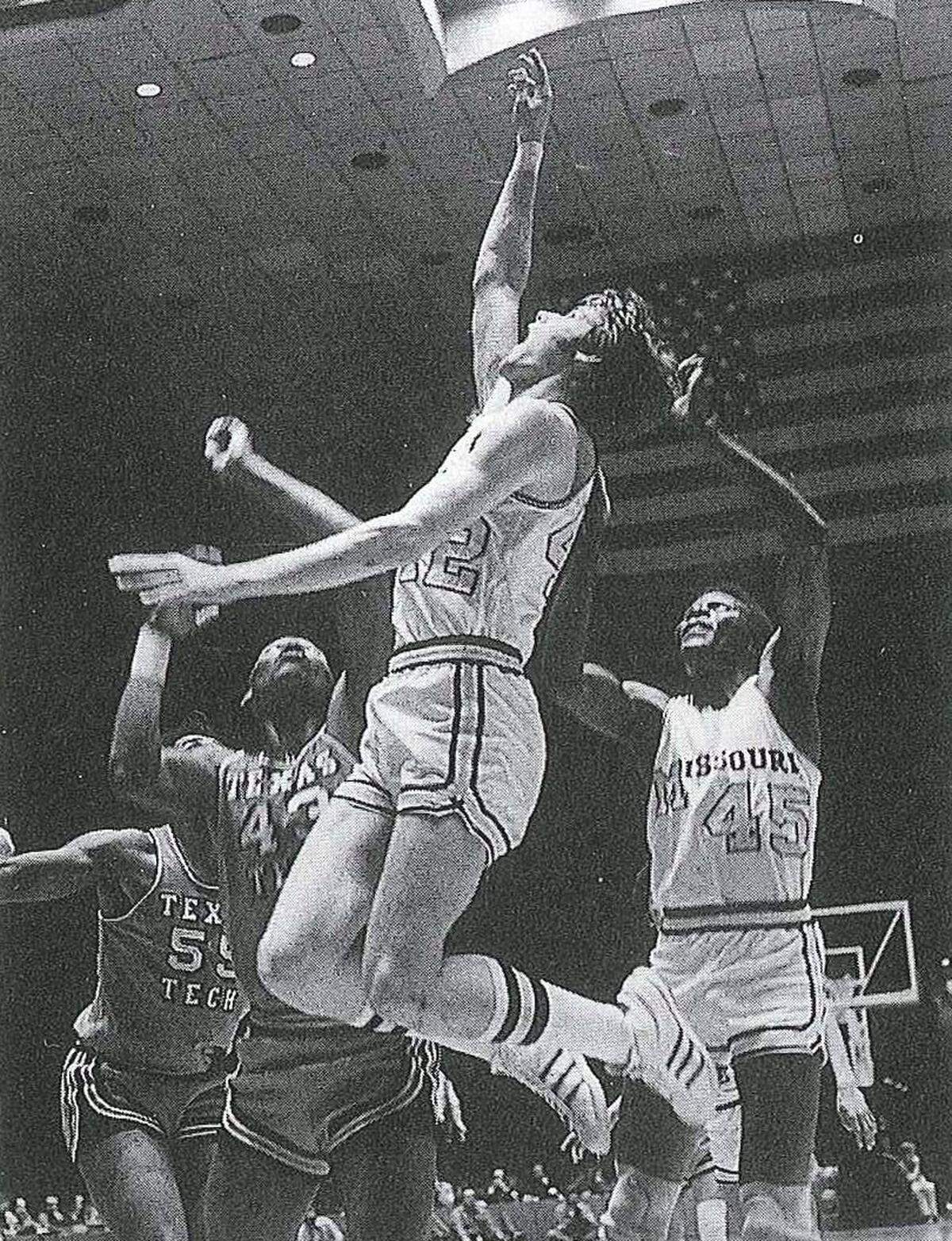 Then a standout Missouri Tigers big man, Kim Anderson (No. 42) operates under the basket during a men’s college basketball game.