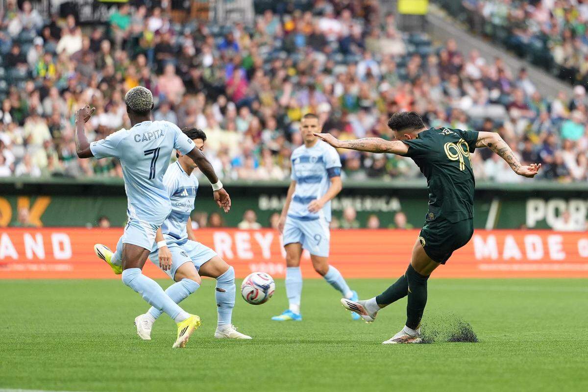 Portland’s Kristoffer Velde, right, scores a goal past Sporting KC’s Capita Capemba during an MLS match at Providence Park in Portland on Saturday, May 9, 2026.