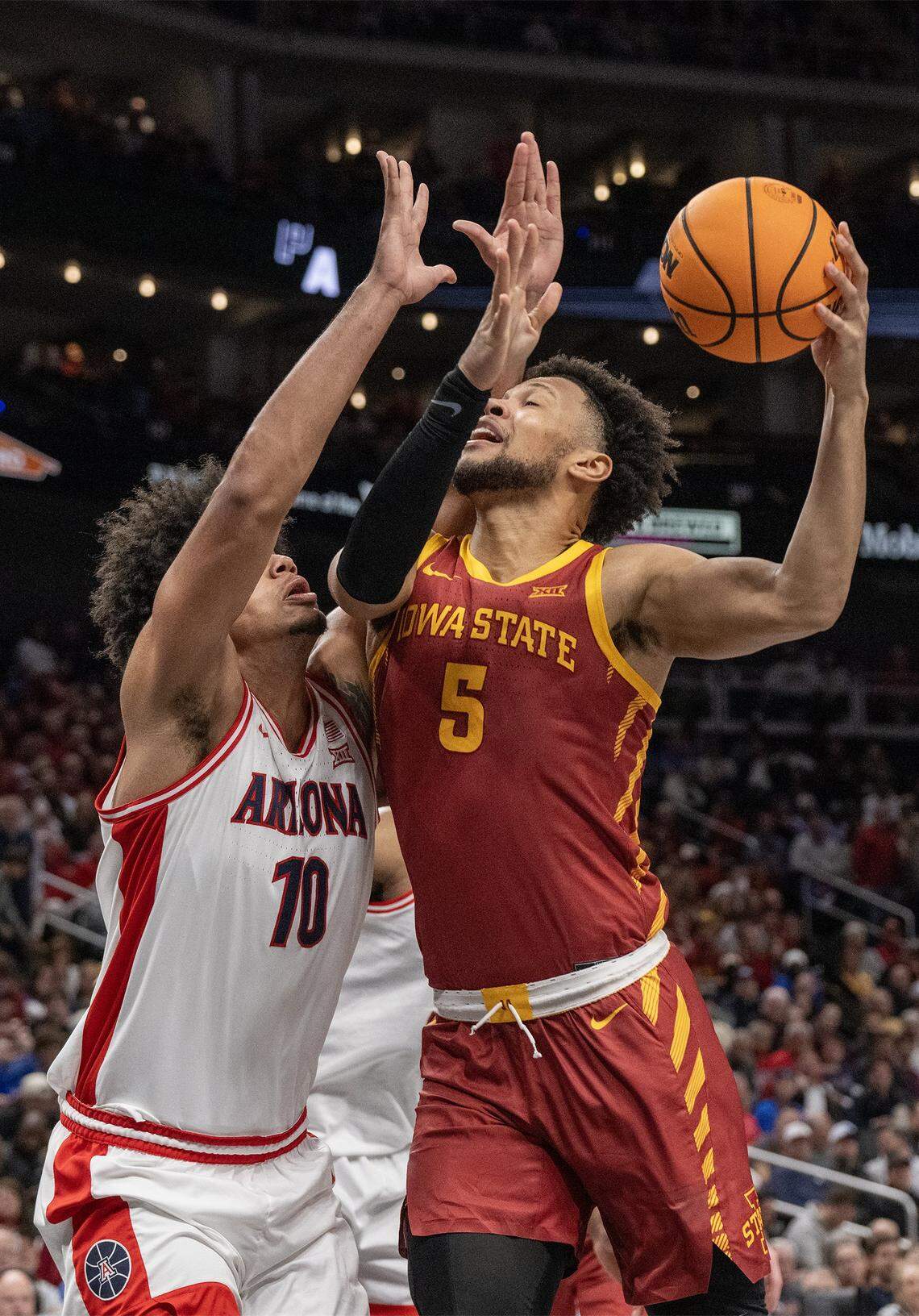 Iowa State Cyclones forward Joshua Jefferson (5) shoots as Arizona Wildcats forward Koa Peat (10) defends during a semifinal game at the Big 12 Men’s Basketball Tournament inside Kansas City’s T-Mobile Center on Friday, March 13, 2026.