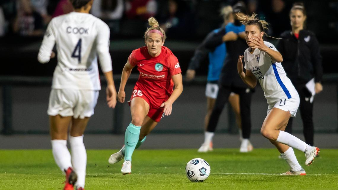 KC Current forward Kristen Hamilton (center) looks for an opening during the team’s Oct. 30 match against the OL Reign at Legends Field in Kansas City, Kan.