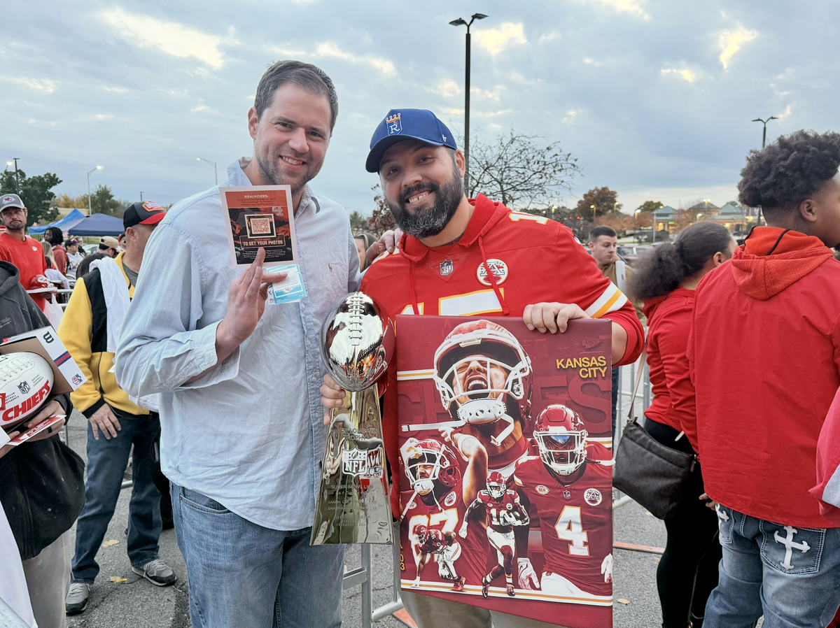 Fans in line to see the Chiefs receiver had a variety of items for Rashee Rice to sign, including these fans who had a replica Lombardi trophy.