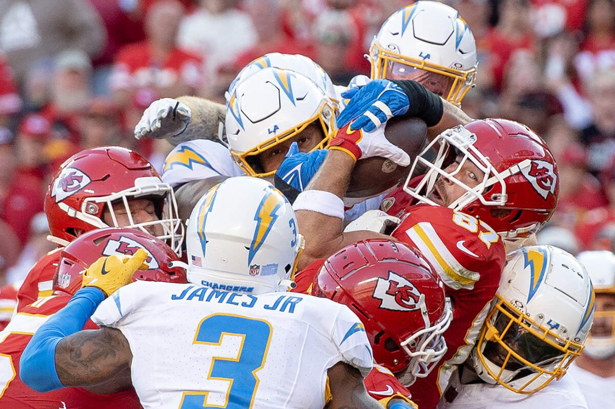 Travis Kelce eyes the goal line as his offensive line pushes him over for a touchdown against the Los Angeles Chargers at Arrowhead Stadium on Oct. 22, 2023.