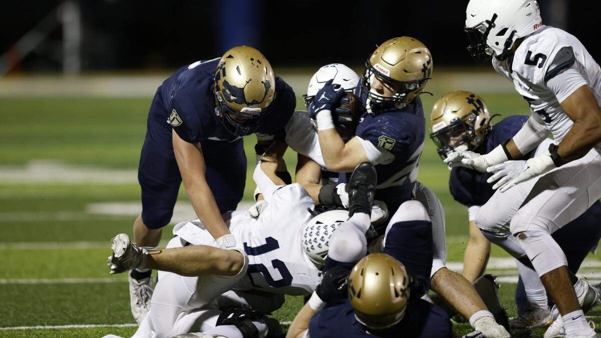 Calin Arndt barreled through the pile for a St. Thomas Aquinas touchdown as the Saints beat five-time defending Kansas state champion Mill Valley 23-22 in a high school football sectional game on Friday, Nov. 15, 2024.