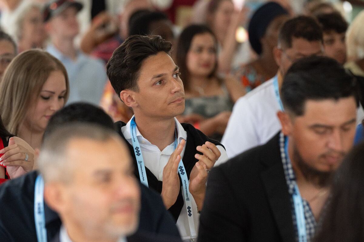 Pro soccer forward Daniel Salloi applauds as new U.S. citizens are introduced by country during a naturalization ceremony prior to Sporting KC’s match against Austin FC on Saturday, June 29, 2024, at Children’s Mercy Park in Kansas City, Kansas.
