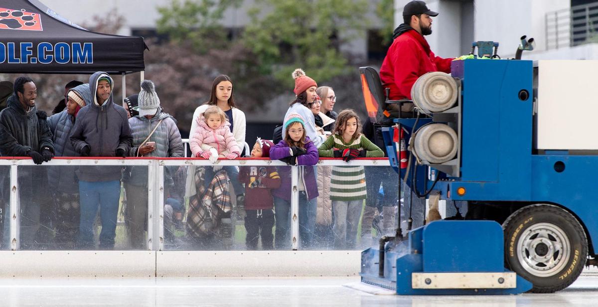 Skaters watch as a worker resurfaces the ice with a Zamboni during the opening day skate at the Crown Center Ice Terrace on Friday, Nov. 3, 2023, in Kansas City.