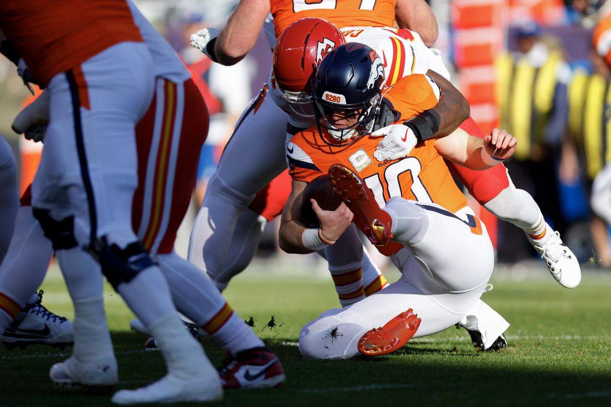 Kansas City Chiefs defensive back Chamarri Conner sacks Broncos quarterback Bo Nix during an NFL Week 11 game at Empower Field At Mile High in Denver on Sunday, Nov. 16, 2025.