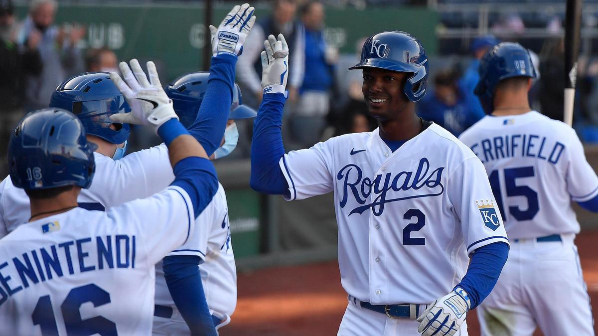 Royals Michael Taylor is congratulated by his teammates after blasting a home run to right center field during the third inning of Thursday’s home opener against the Texas Rangers.