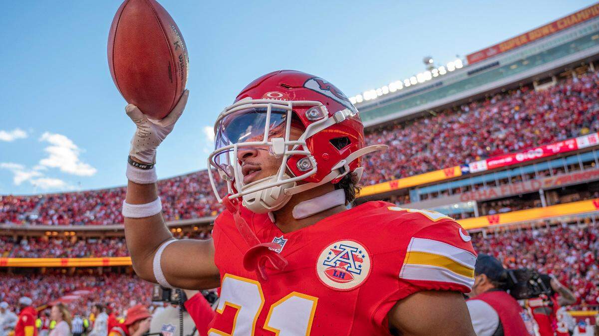 Kansas City Chiefs safety Jaden Hicks (21) holds up the game ball following the Chiefs’ 16-14 victory over the Denver Broncos during an NFL game on Sunday, Nov. 10, 2024, at GEHA Field at Arrowhead Stadium.