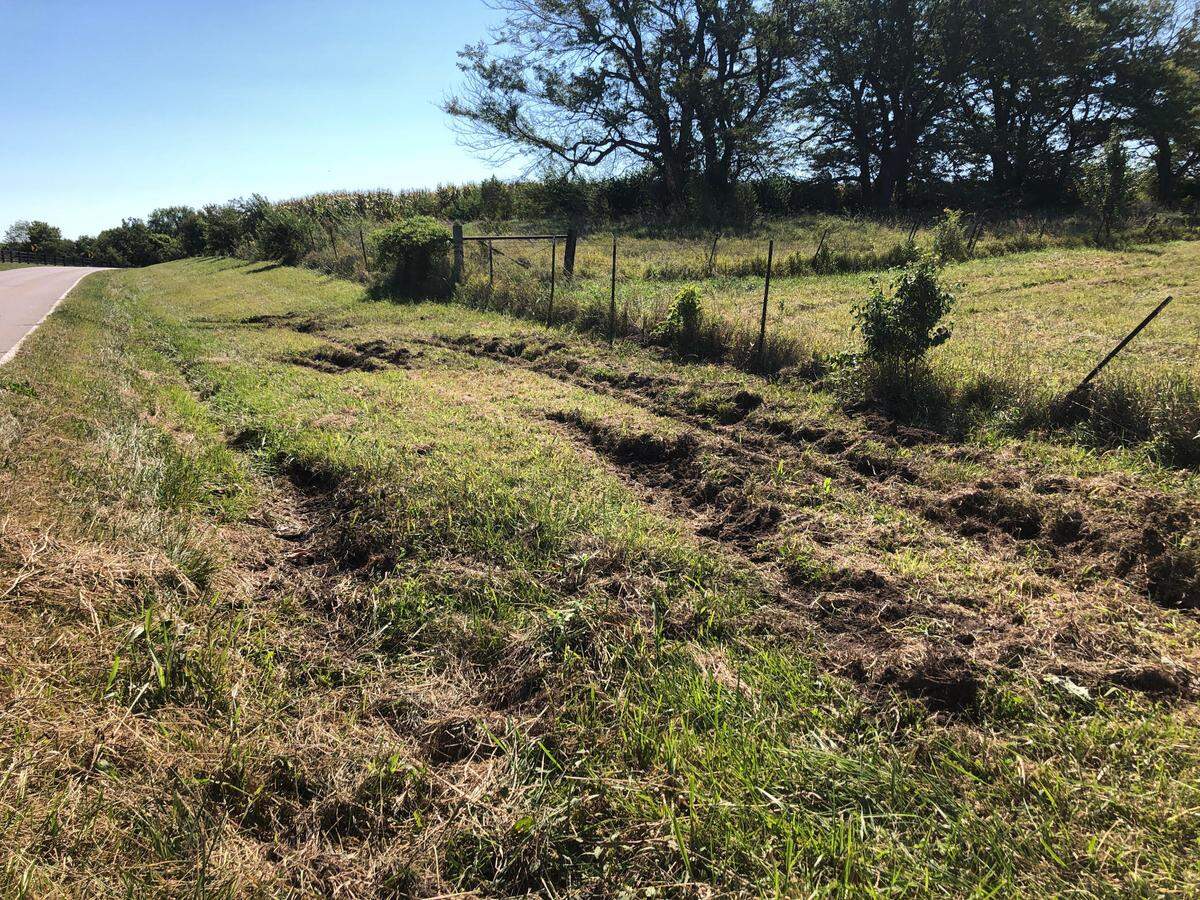 Tire tracks off Mt. Olivet Road between Jami Drive and Northeast 120th Street show where a school bus carrying 30 Smithville elementary students left the road and overturned on Monday, September 12.