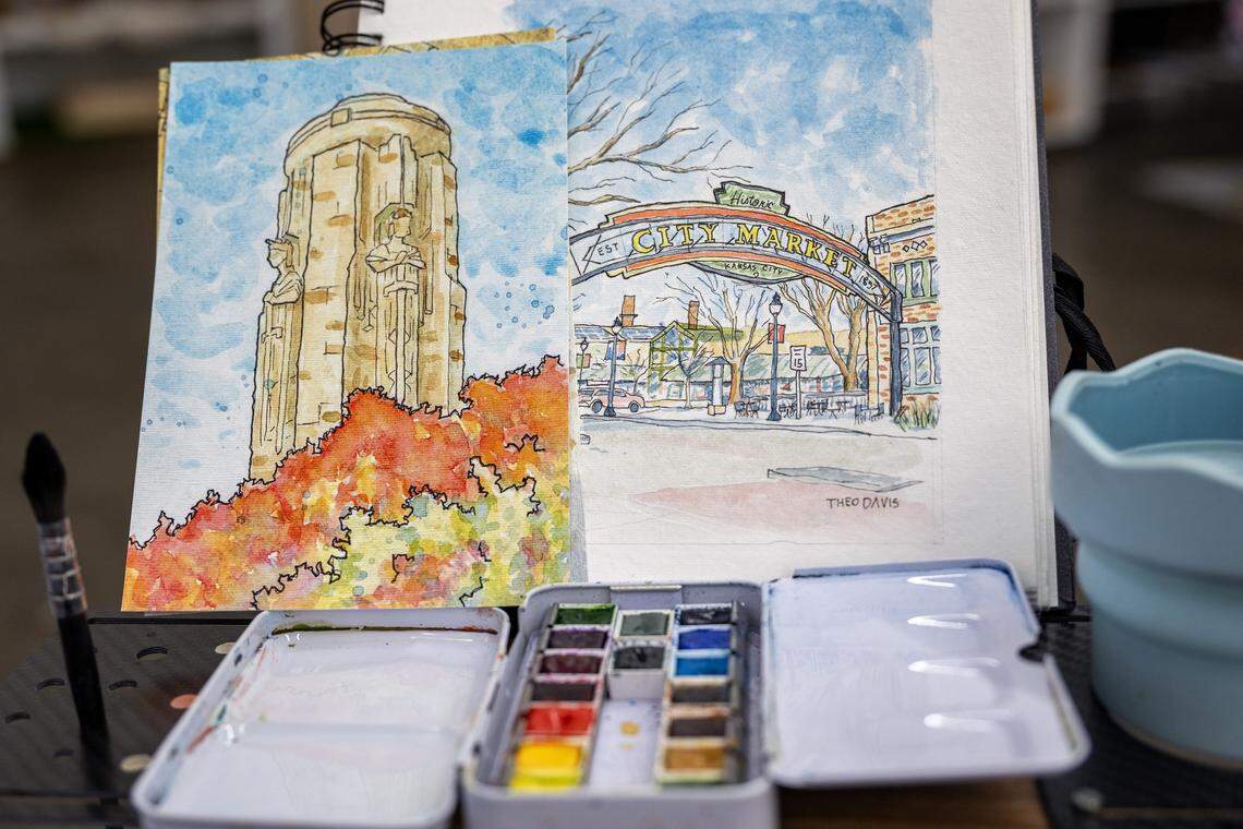 An easel displaying original artwork, printed pieces and art materials sits near artist Theo Davis' booth inside Painted Tree on Tuesday, Dec. 16, 2025, in Kansas City.