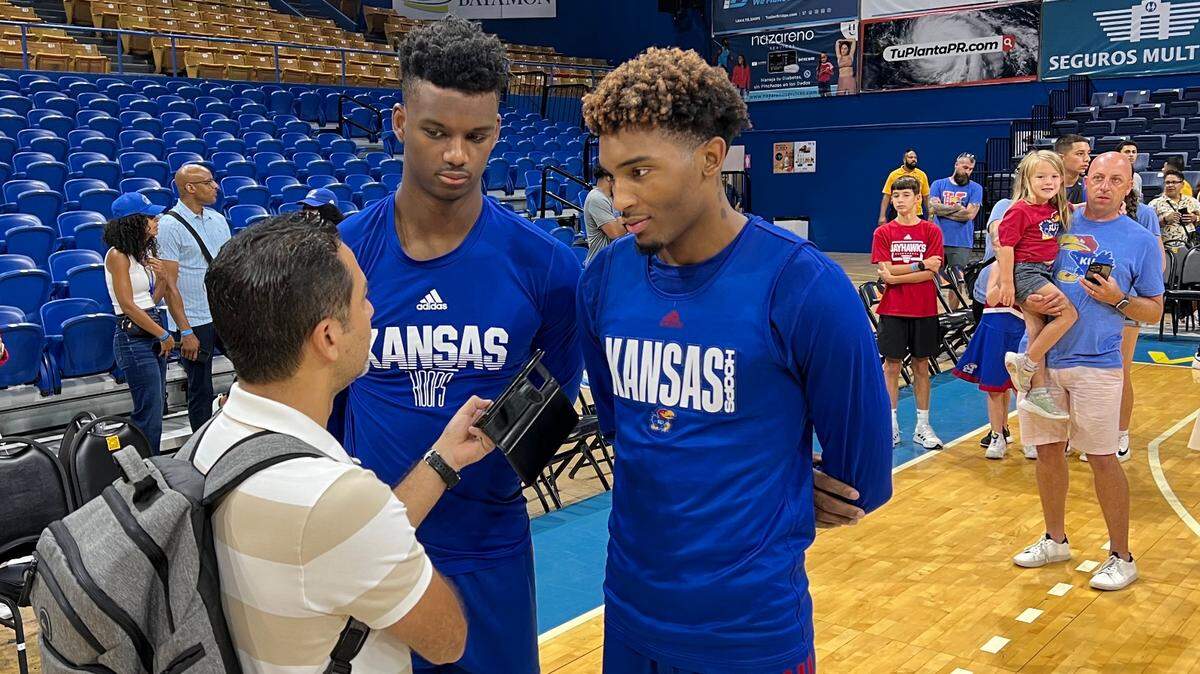 KU’s Arterio Morris, right, and KJ Adams were interviewed by a reporter from a Puerto Rico TV station after combining for 39 points in KU’s win over the Puerto Rico Select team on Thursday in San Juan, PR.
