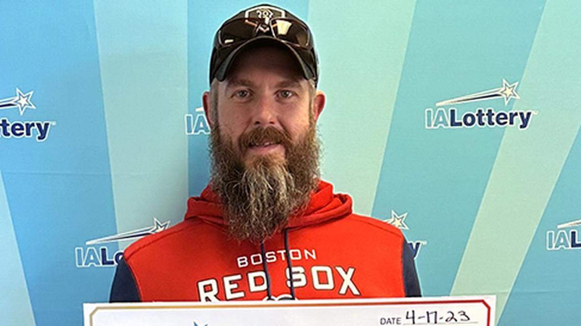 Carl Gibbs Jr. with his oversized check. 