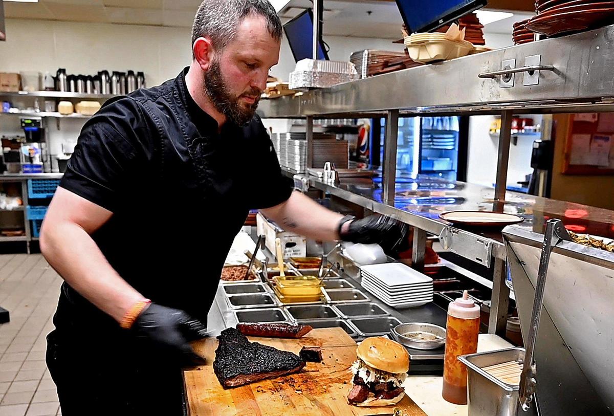 Drew Prewitt, executive chef at Char Bar in Westport, prepares a Burnt Heaven Sandwich, that Kansas City Star Lead Political Reporter, Jonathan, chose as his Let’s Dish favorite.