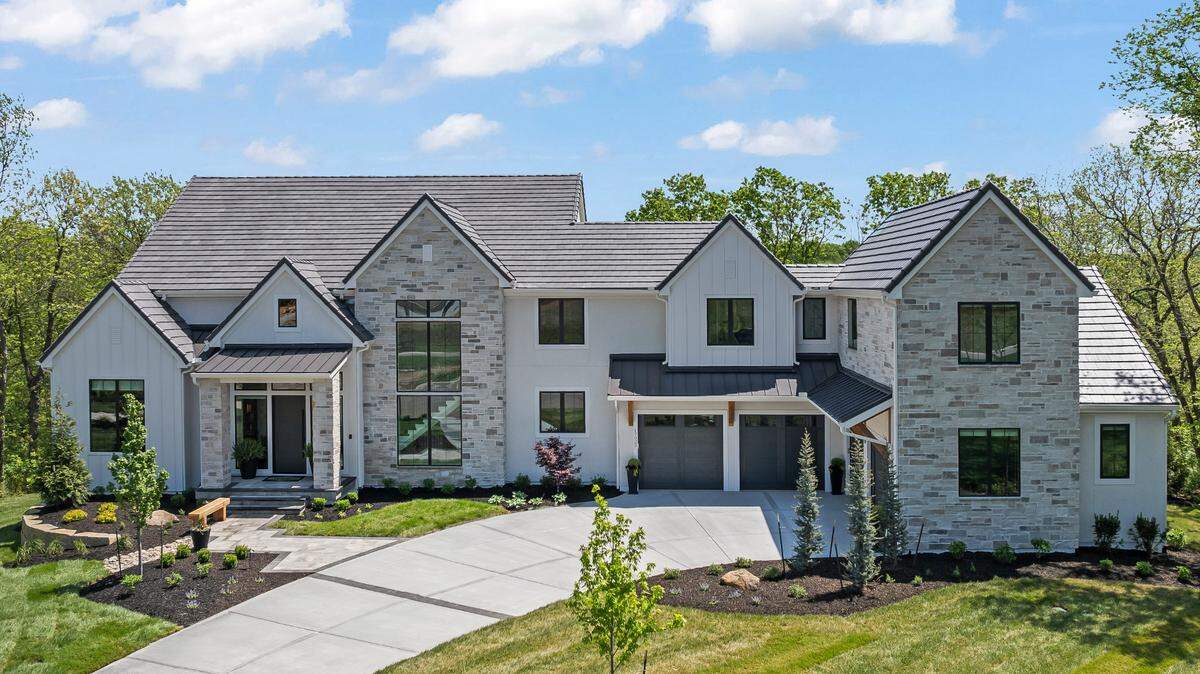 Nestled within the serene landscapes of the Village of Loch Lloyd lies a haven for families seeking the quintessential blend of luxury, security, and community spirit. This stunning estate exemplifies the architectural excellence found throughout the neighborhood—with its elegant stonework, expansive windows, and manicured surroundings.