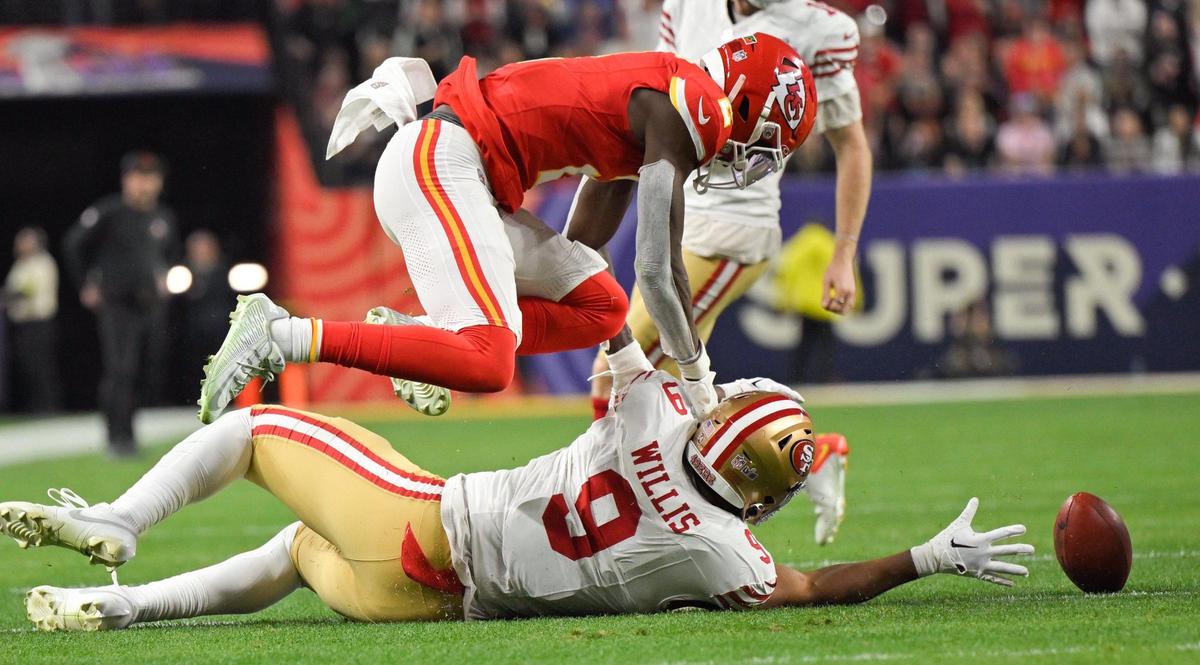 San Francisco 49ers tight end Brayden Willis (9) reaches for the ball while Kansas City Chiefs cornerback Joshua Williams (2) dives for it after the Chiefs blocked a point after attempt in the fourth quarter of Super Bowl LVIII, Sunday, Feb. 11, 2024, in Las Vegas.