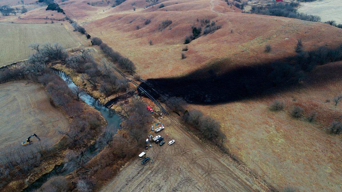 In this photo taken by a drone, cleanup continues in the area where the ruptured Keystone pipeline dumped oil into a creek in Washington County, Kan., Friday, Dec. 9, 2022.
