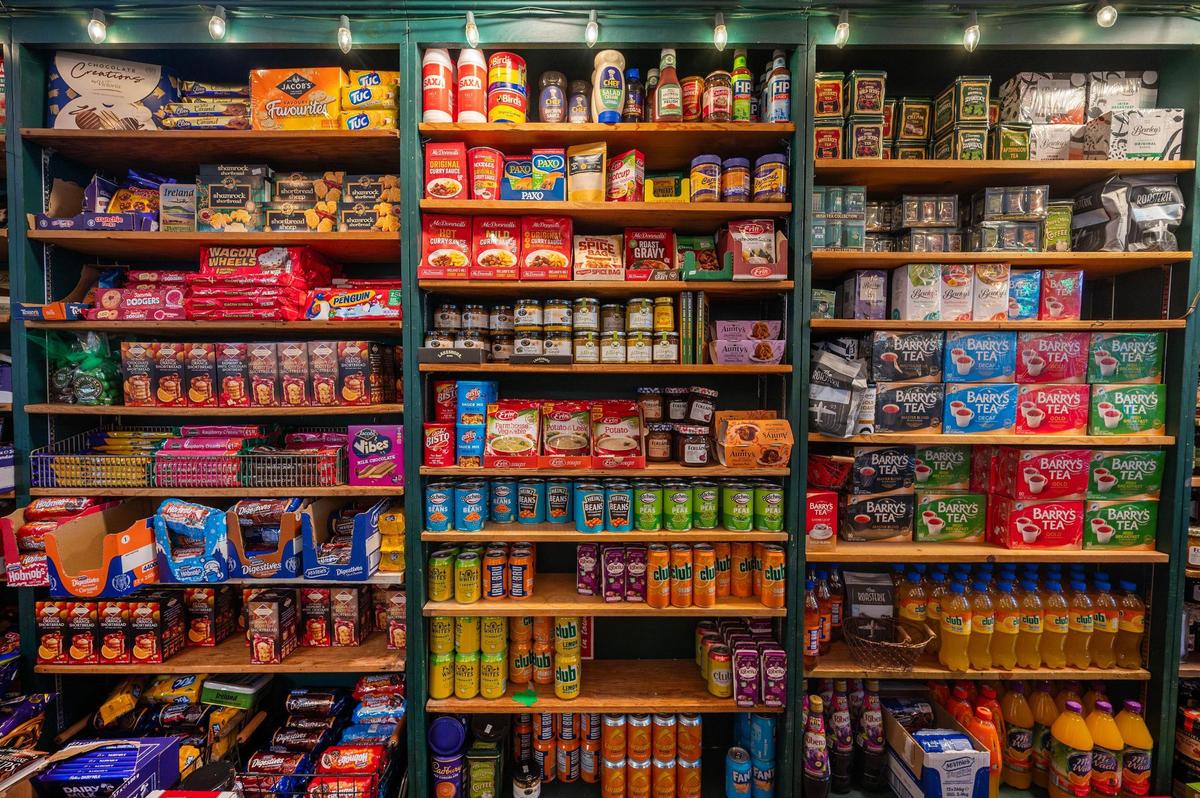 Shelves stocked with Irish foods, including mushy peas, are displayed at Browne’s Irish Marketplace.