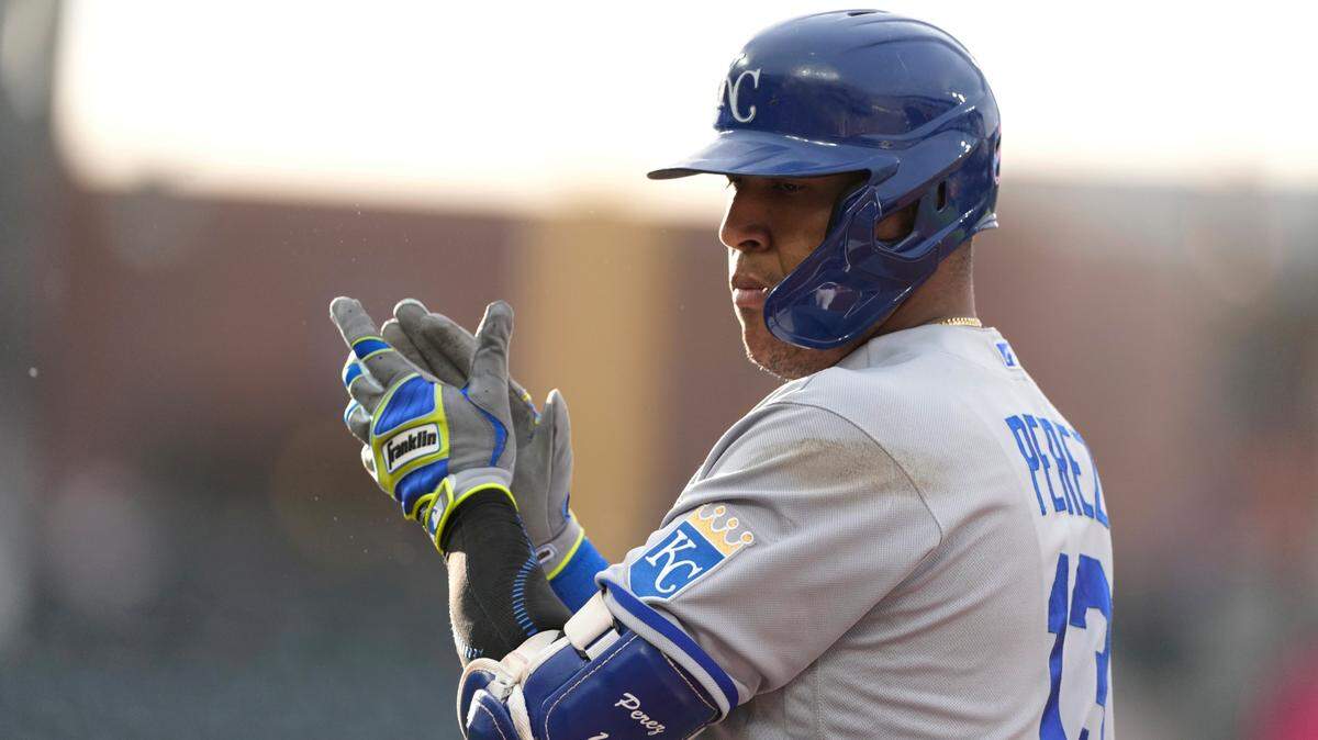 Kansas City Royals’ Salvador Perez claps after reaching first base with a single off Colorado Rockies starting pitcher Kyle Freeland during the first inning of a baseball game Friday, May 13, 2022, in Denver.(AP Photo/David Zalubowski)
