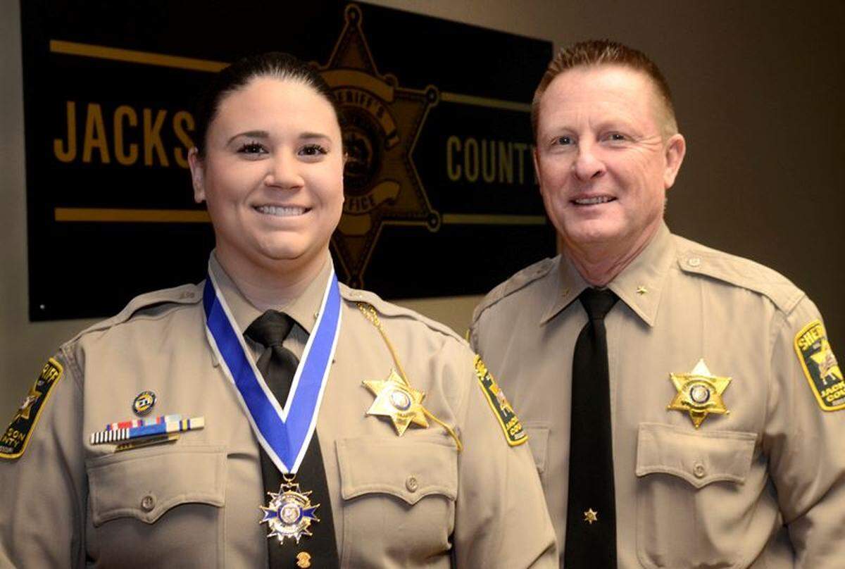 Jackson County Deputy Lauren Michael was presented a medal of valor in 2018 by then-Sheriff Mike Sharp for her role during an altercation with shoplifting suspect.