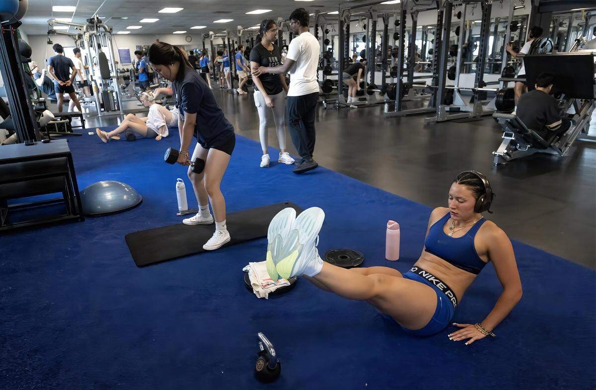 Track athlete Morgan Binsfield, 22, right, from Duluth, Minnesota, was in full training mode on Tuesday, Sept. 16, 2025, at UMKC’s Swinney Center in Kansas City. She was using the fitness center, available to students, staff and community members.