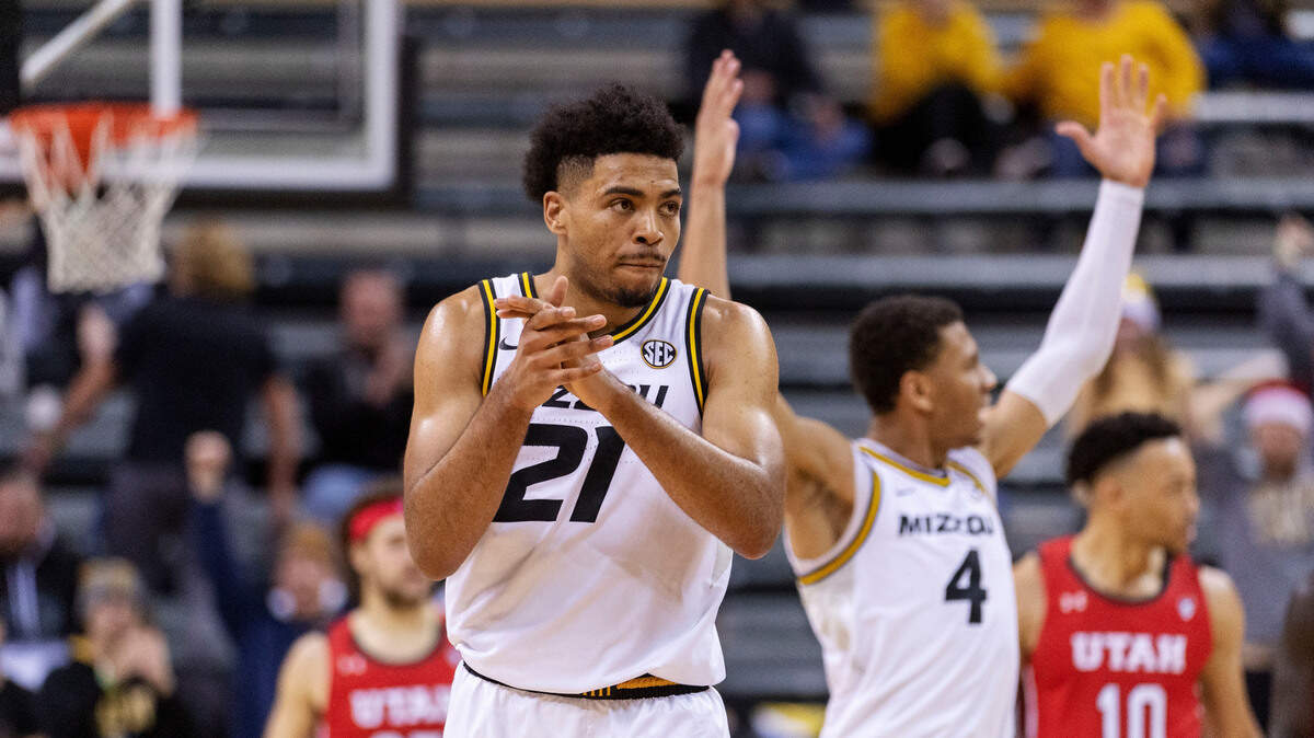 Missouri’s Ronnie DeGray III celebrates with teammates during the final minute of the second half of an NCAA college basketball game against Utah Saturday, Dec. 18, 2021, in Columbia, Mo. (AP Photo/L.G. Patterson)