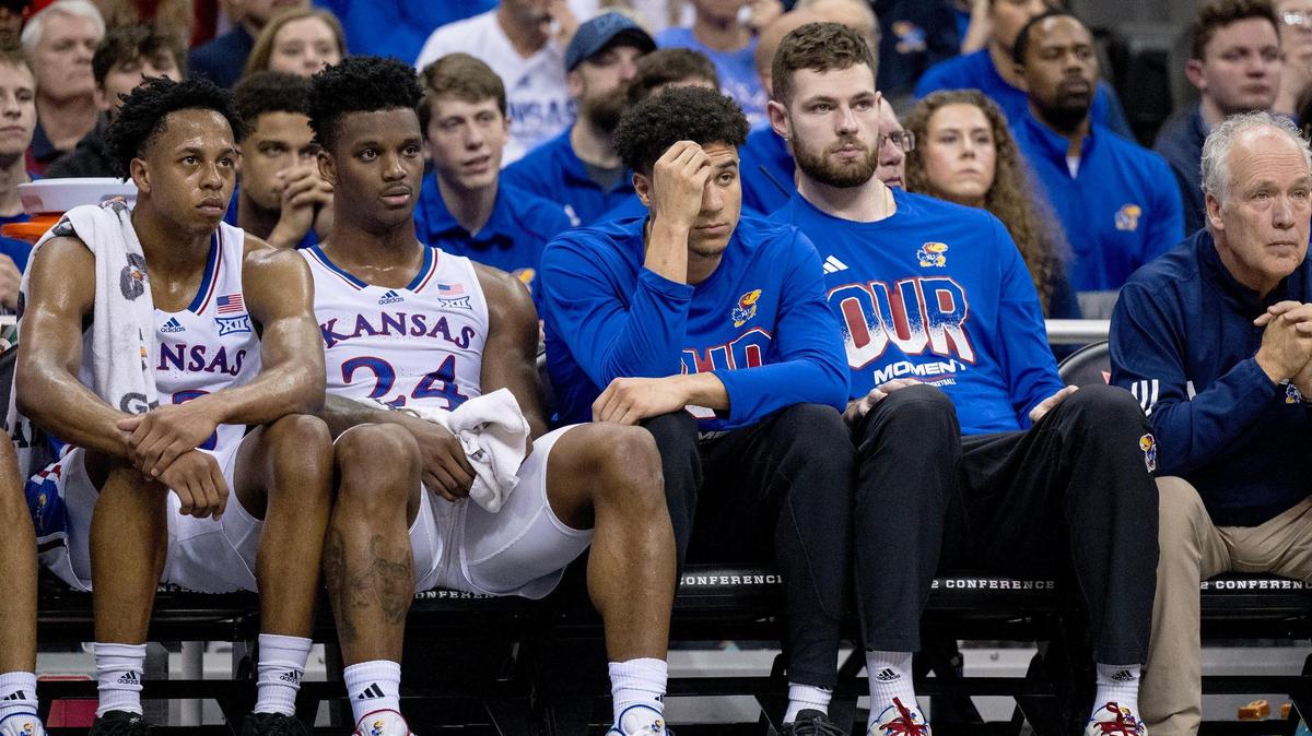 Kansas Jayhawks guard Elmarko Jackson (13), forward K.J. Adams (24), guard Kevin McCullar Jr. and center Hunter Dickinson sit on the bench during a Big 12 Tournament game against the Cincinnati Bearcats on Wednesday, March 13, 2024, in Kansas City.