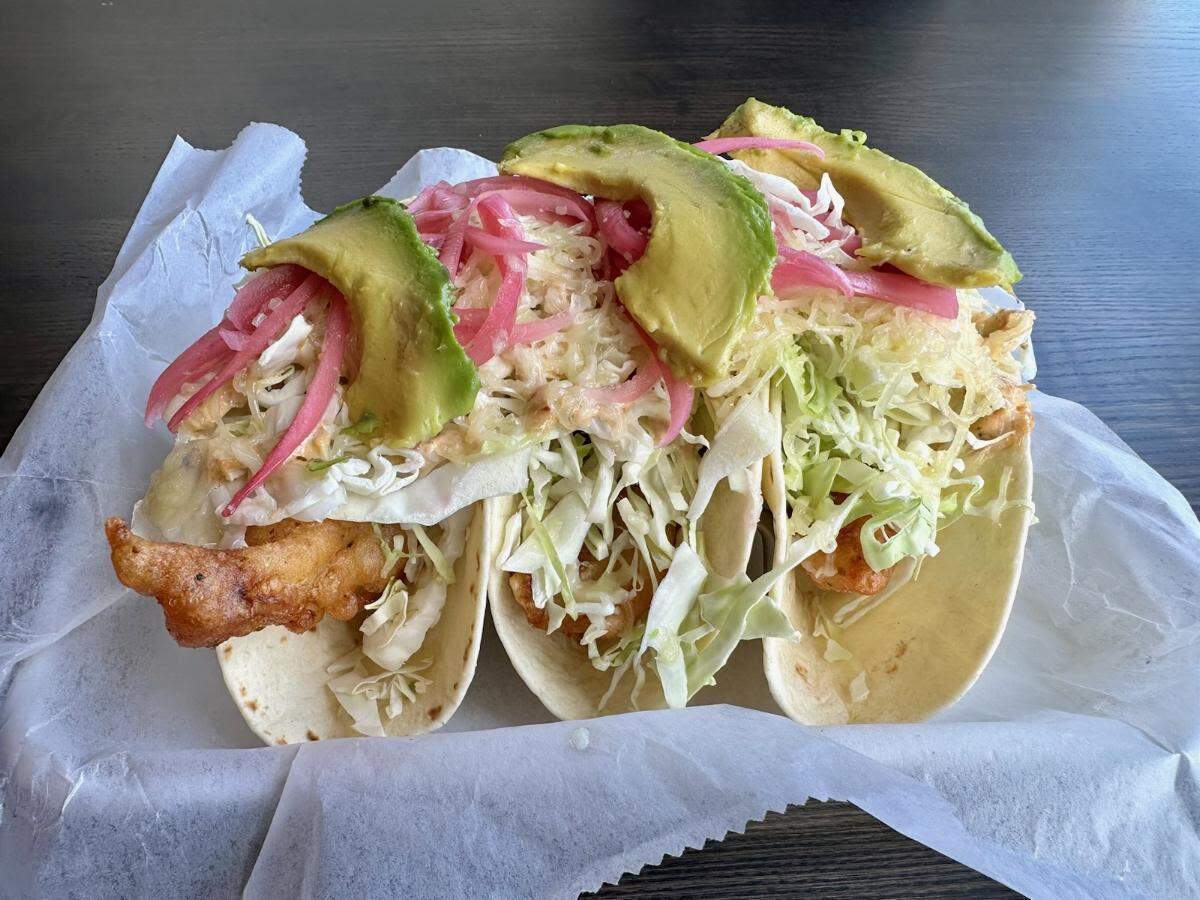 Barrio Taqueria has a taco-centric menu that includes its beer-battered or pepper grilled white fish tacos with shredded cabbage, pickled onion, avocado and chipotle aioli.