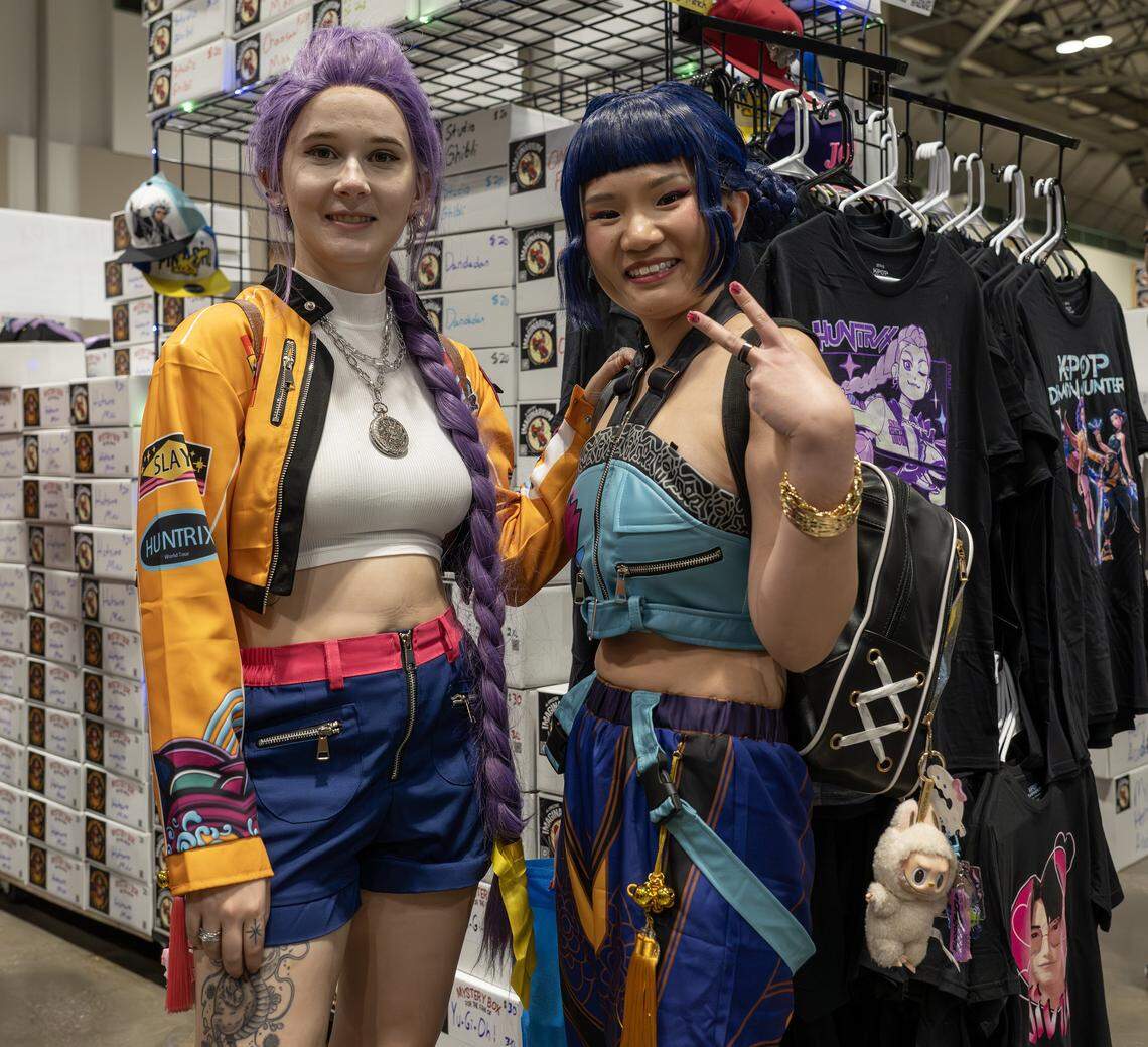 Mackenna Haney, left, and Cyn Thompson cosplay as characters from the movie “K-Pop Demon Hunters” during Planet Anime at the Kansas City Convention Center on Saturday, Nov. 22, 2025.