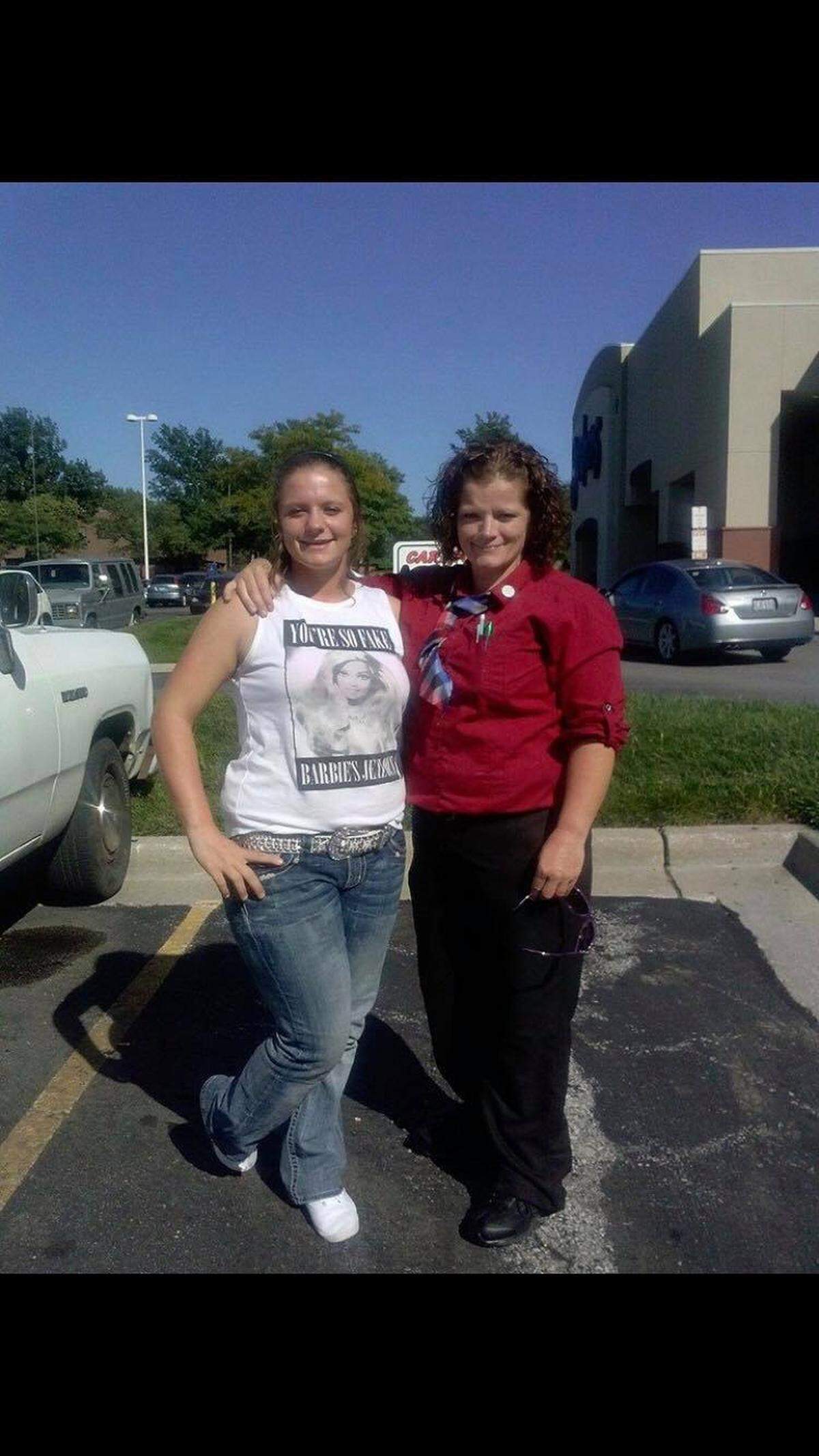 Angela Green (right) with her daughter. Green was killed Monday in a shooting. Prosecutors have charged Nathan Ayers with first-degree murder. He is at large.