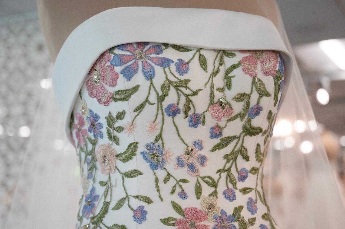 A bridal dress with embroidered flowers is seen on display at Essense of Australia on Monday, Aug. 5, 2024, in Lenexa.