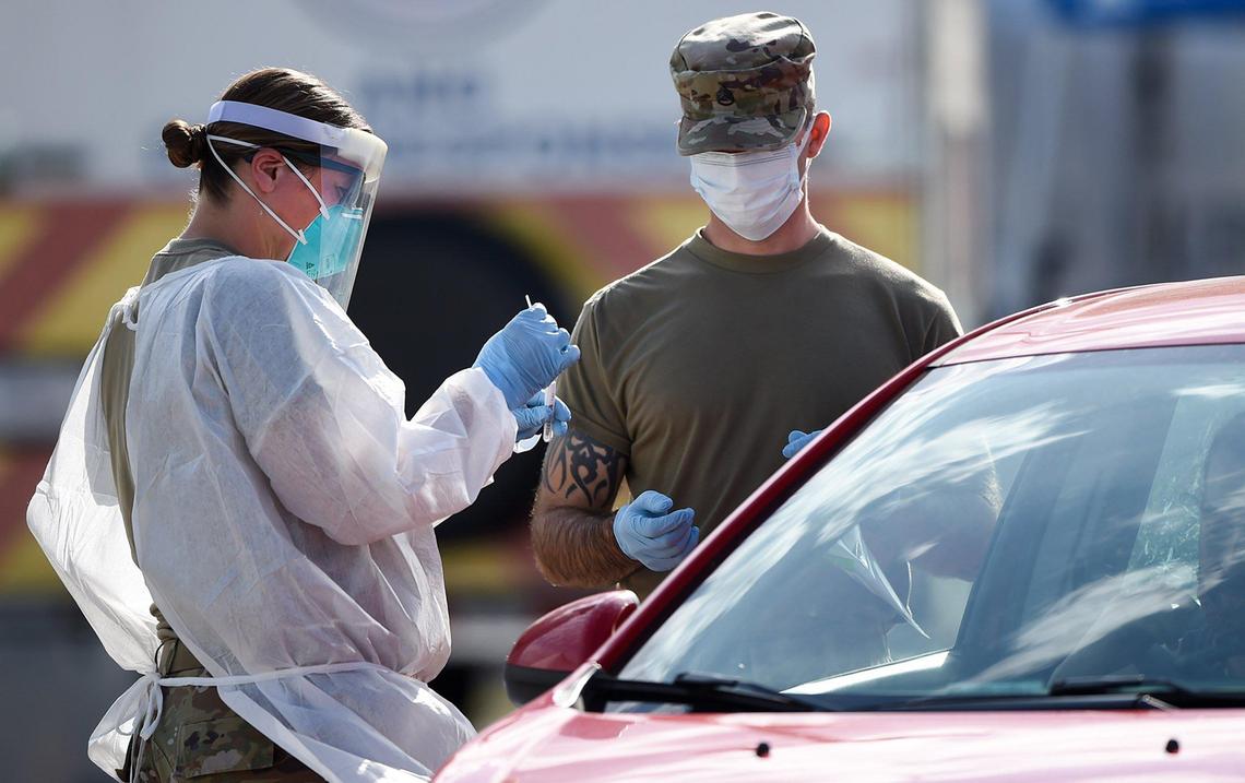Maj. Kristie Miller (left) of the Missouri Air National Guard’s 139th Airlift Wing of St. Joseph, Missouri and Staff Sgt. Christopher Reaves of 138th Infantry Regiment of the Missouri Army National Guard, perform COVID-19 tests during a free drive-thru testing clinic for restaurant workers and residents of Missouri on Monday, July 13, 2020, at the Homefield Sports Facility, 5000 Bannister Rd., in Kansas City. The free testing will continue from 7 a.m. until 7 p.m., on July 14-15. Residents of Missouri can secure an appointment by registering online at www.kcmo.gov or by calling 877-435-8411.