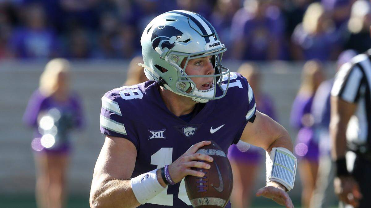 Kansas State Wildcats quarterback Will Howard (18) scrambles against the Oklahoma State Cowboys during the second quarter at Bill Snyder Family Football Stadium on Oct. 29, 2022.