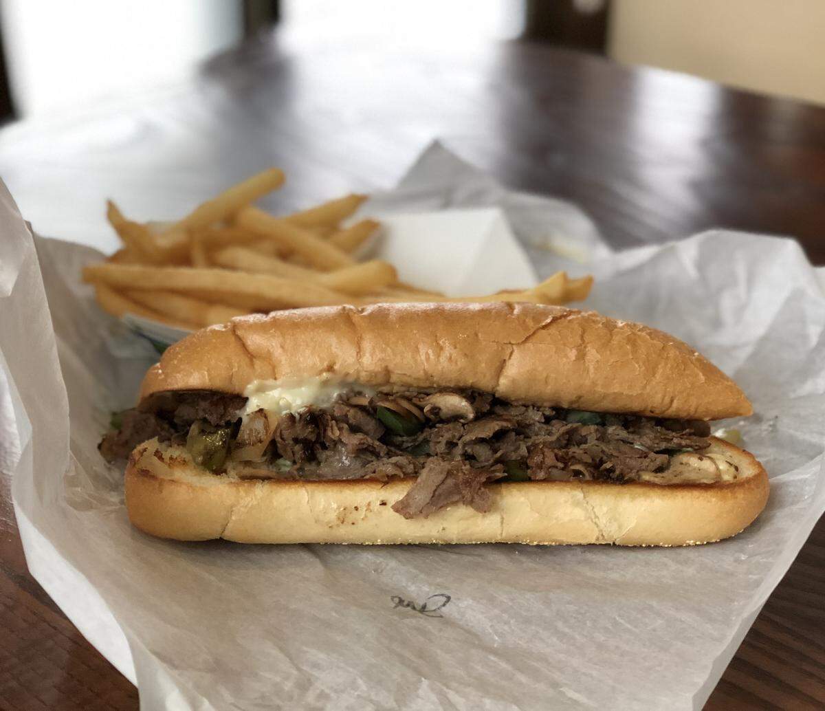 Philly Time serves a dozen different cheesesteaks, including the Supreme ($7.59 for a regular), made by cooking steak or chicken on a grill with onions and mushrooms, and then adding white American cheese. The sandwich is served on a traditional Amoroso hoagie.