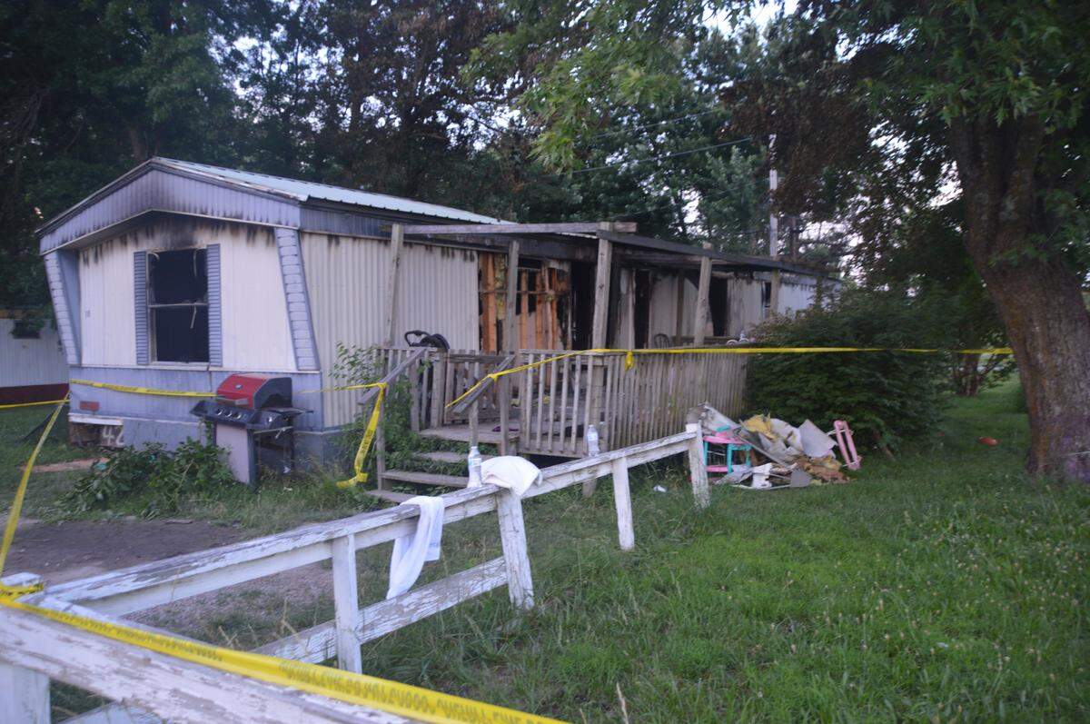 A firefighter entered the home but was turned back by the flames and smoke, said a witness, Chase Schrecengost.