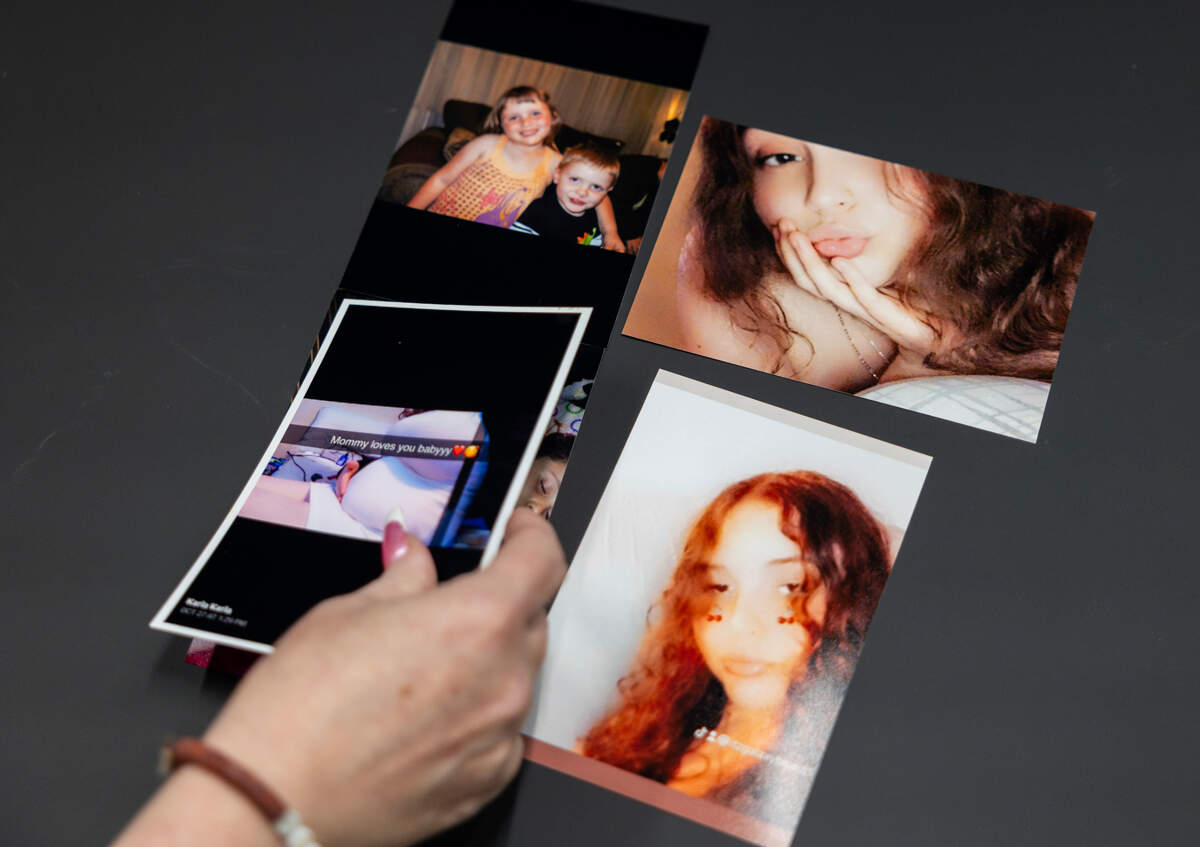 Jennifer Brown lays out photos of her daughter, Karla Brown, who was killed in a fatal shooting at the Independence Center mall in November.