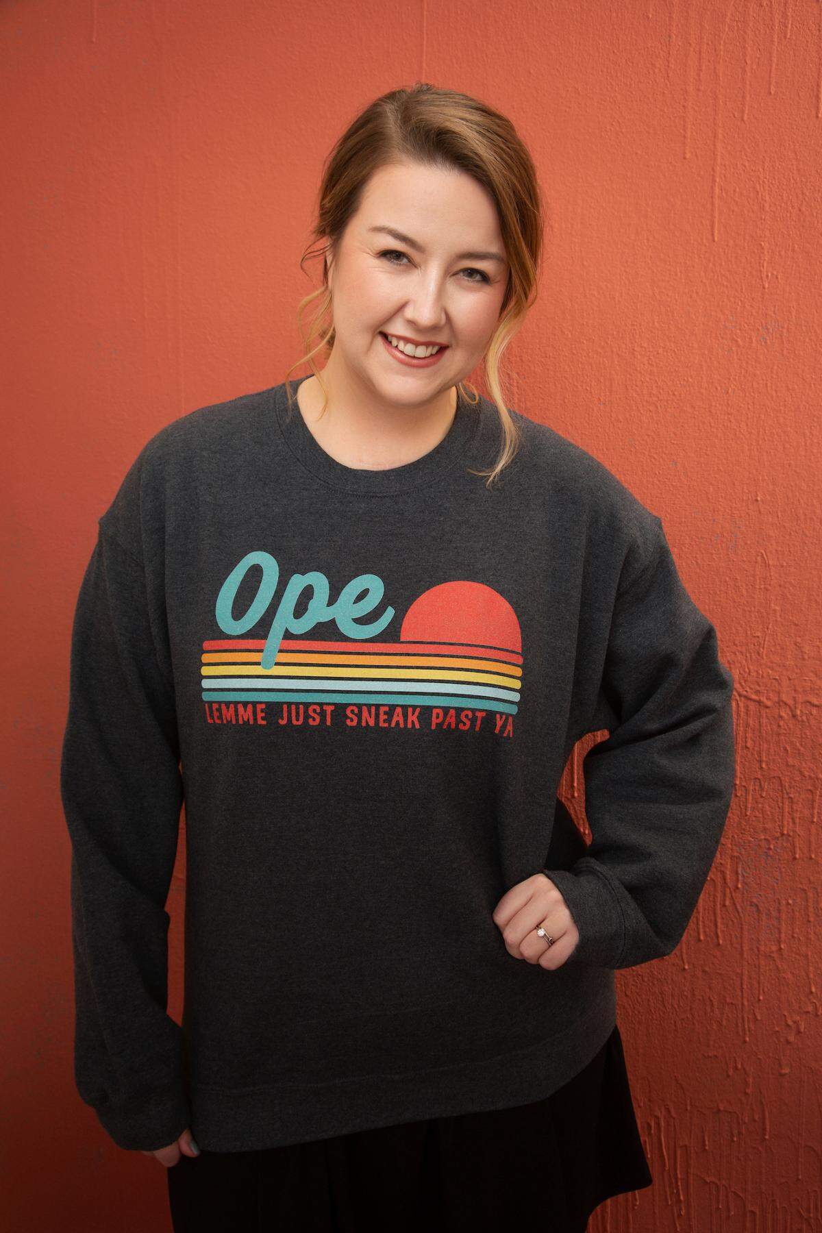 Taylor Kay Phillips shows off a quintessential Midwest saying, “Ope, lemme just sneak past ya.” Her “Guide to Midwestern Conversation” comes out in April. ​