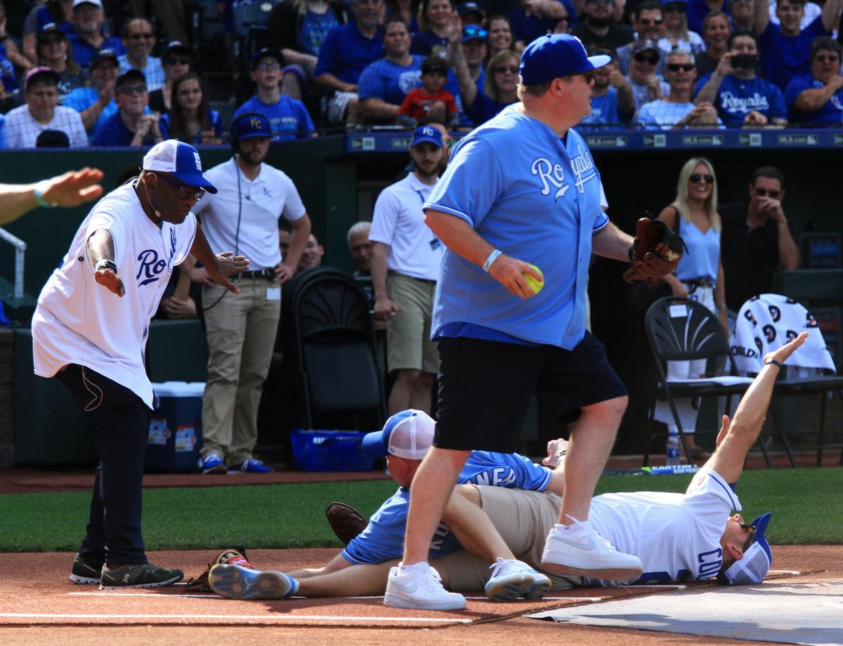 “Today” show host Al Roker, who served as umpire, calls Chiefs punter Dustin Colquitt safe after a play at home plate with Eric Stonestreet, standing, and David Koechner.