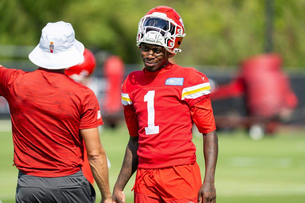 Kansas City Chiefs wide receiver Xavier Worthy (1) talks to a coach during Chiefs practice on Friday, Oct. 3, 2025, in Kansas City.