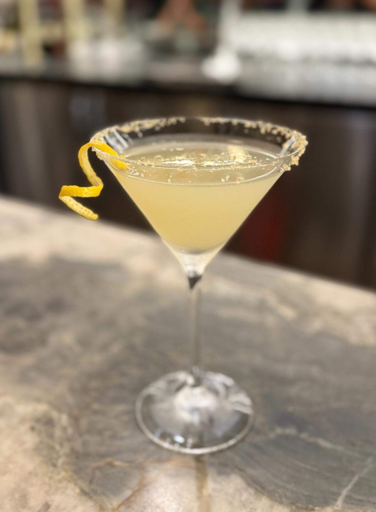 Ginger lemon drop cocktail at Prime Facie includes citrus vodka, ginger liqueur, ginger simple, sour, crystallized ginger and orange rim and lemon peel.