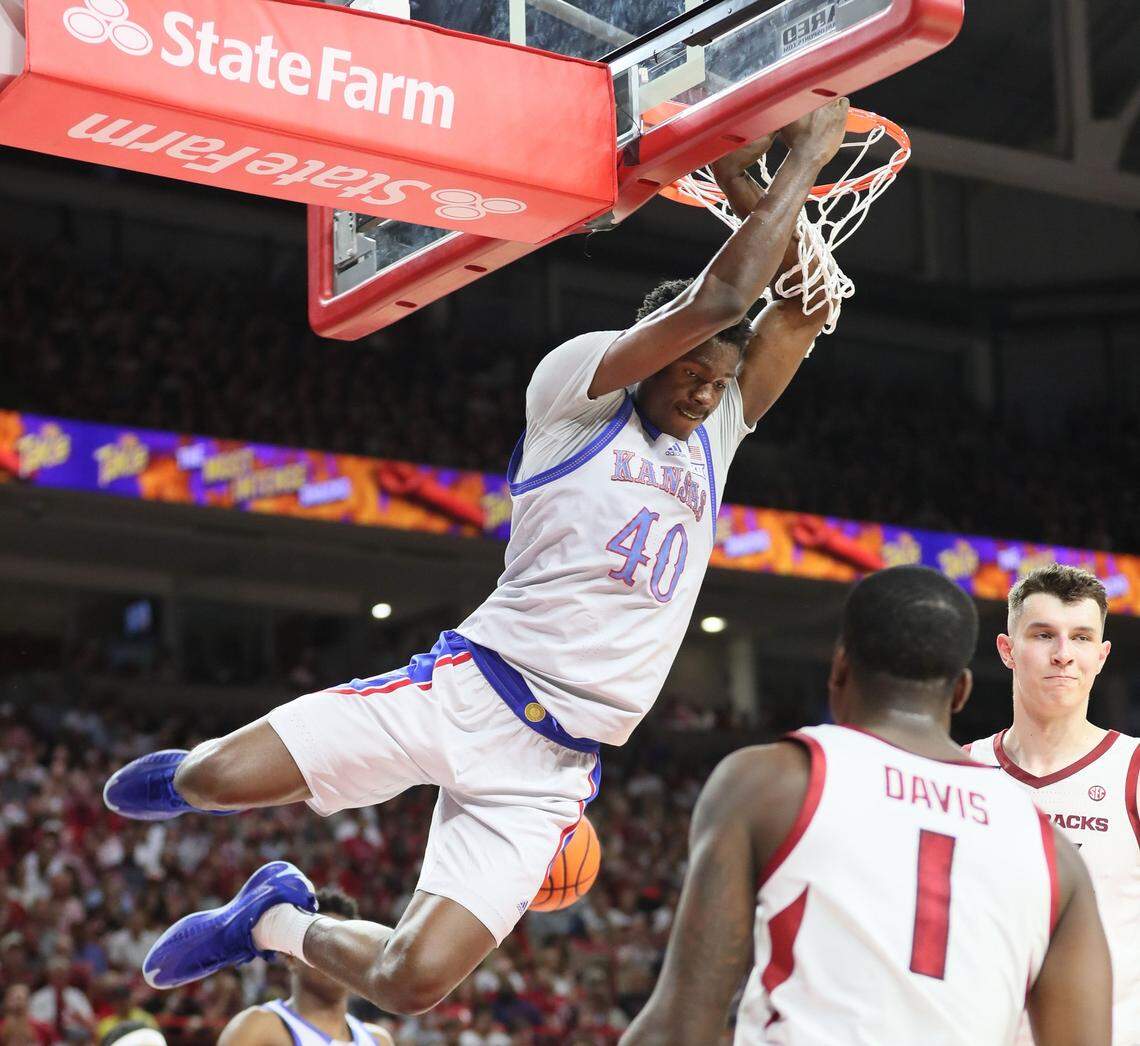 Kansas Jayhawks forward Flory Bidinga dunks the basketball during Friday evening’s exhibition game against the Arkansas Razorbacks at Bud Walton Arena in Fayetteville, Ark.