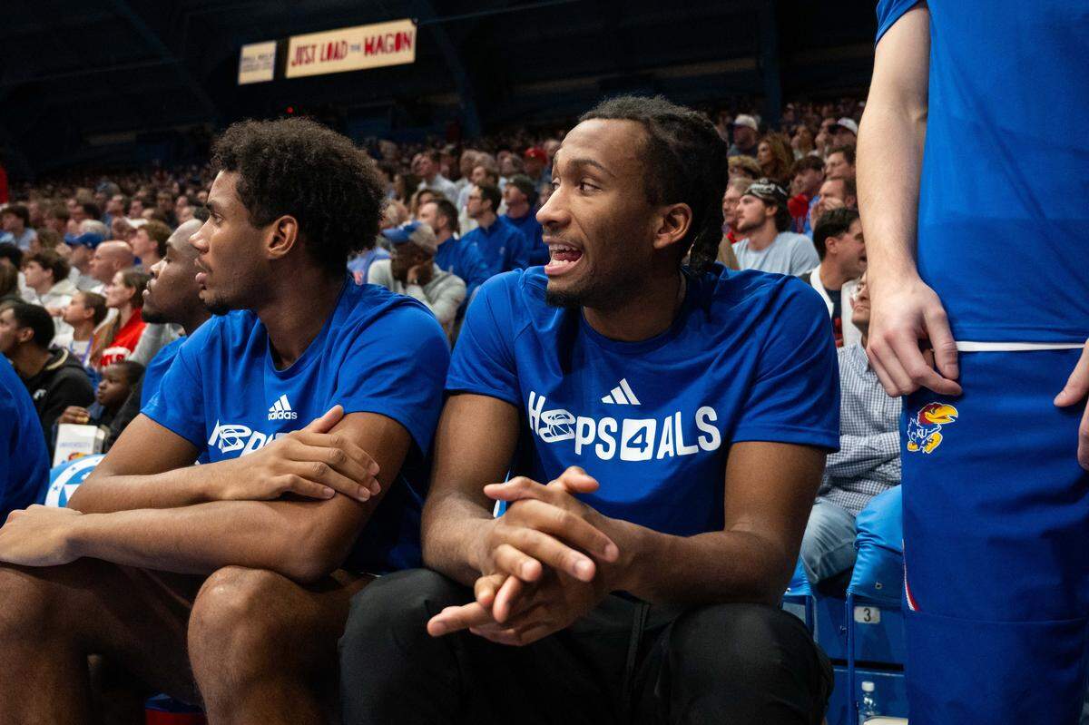Kansas Jayhawks guard Darryn Peterson (22) encourages his teammates from the bench in the second half vs. the UConn Huskies on Tuesday, December 2, 2025, at Allen Fieldhouse.
