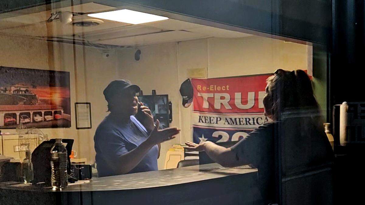 A worker at Autobot Towing told Michelle Brown, right, to go outside the office and wait.