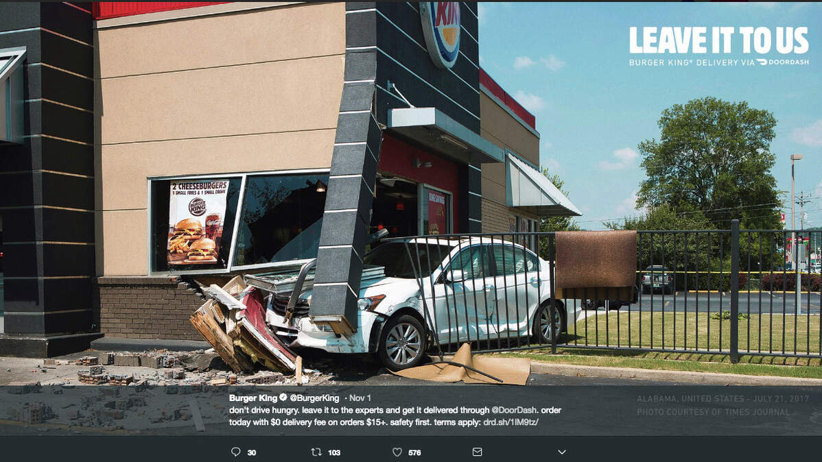 Burger King’s new print ads promoting home delivery service through Doordash use photos of real cars crashed into Burger King buildings. The chain says no one was seriously harmed in any of the crashes.
