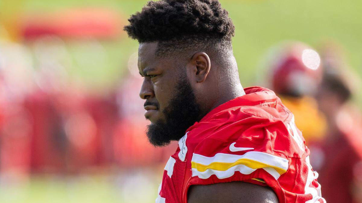 Kansas City Chiefs guard Trey Smith (65) walks the field before practice at Chiefs Training Camp on Tuesday, Aug. 12, 2025, in St. Joseph.